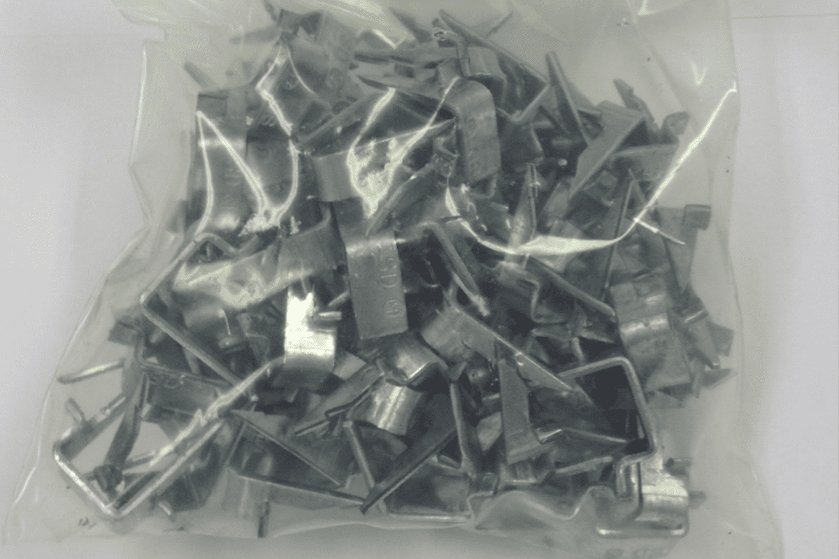 Small metal fasteners sealed in bag