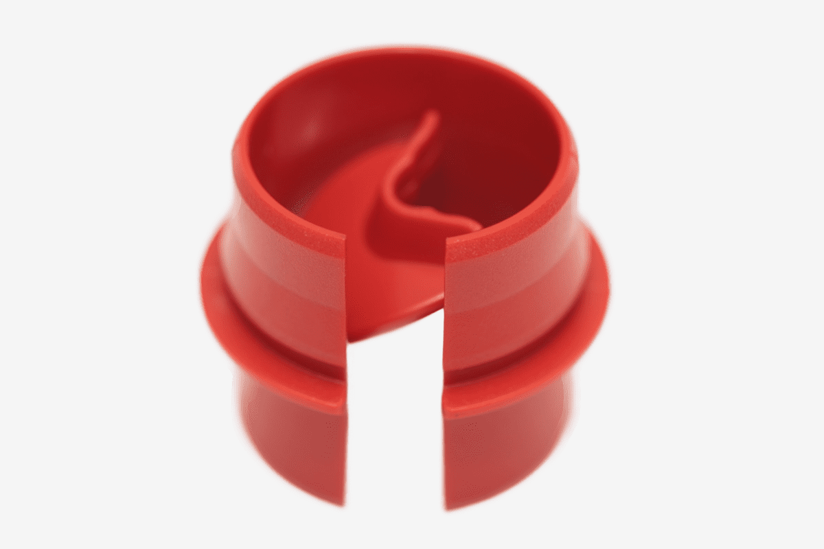 Circular red plastic object split open