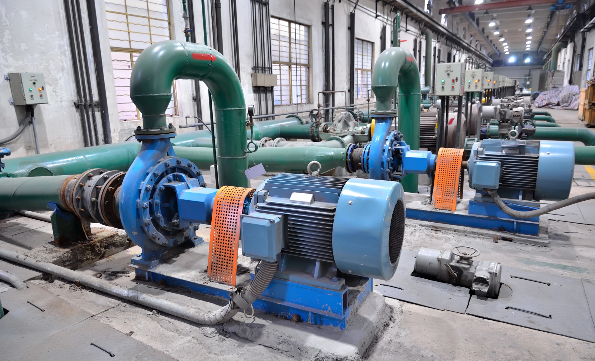 Industrial pumps in a factory setting